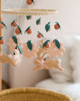 Rabbit mobile with pink flowers