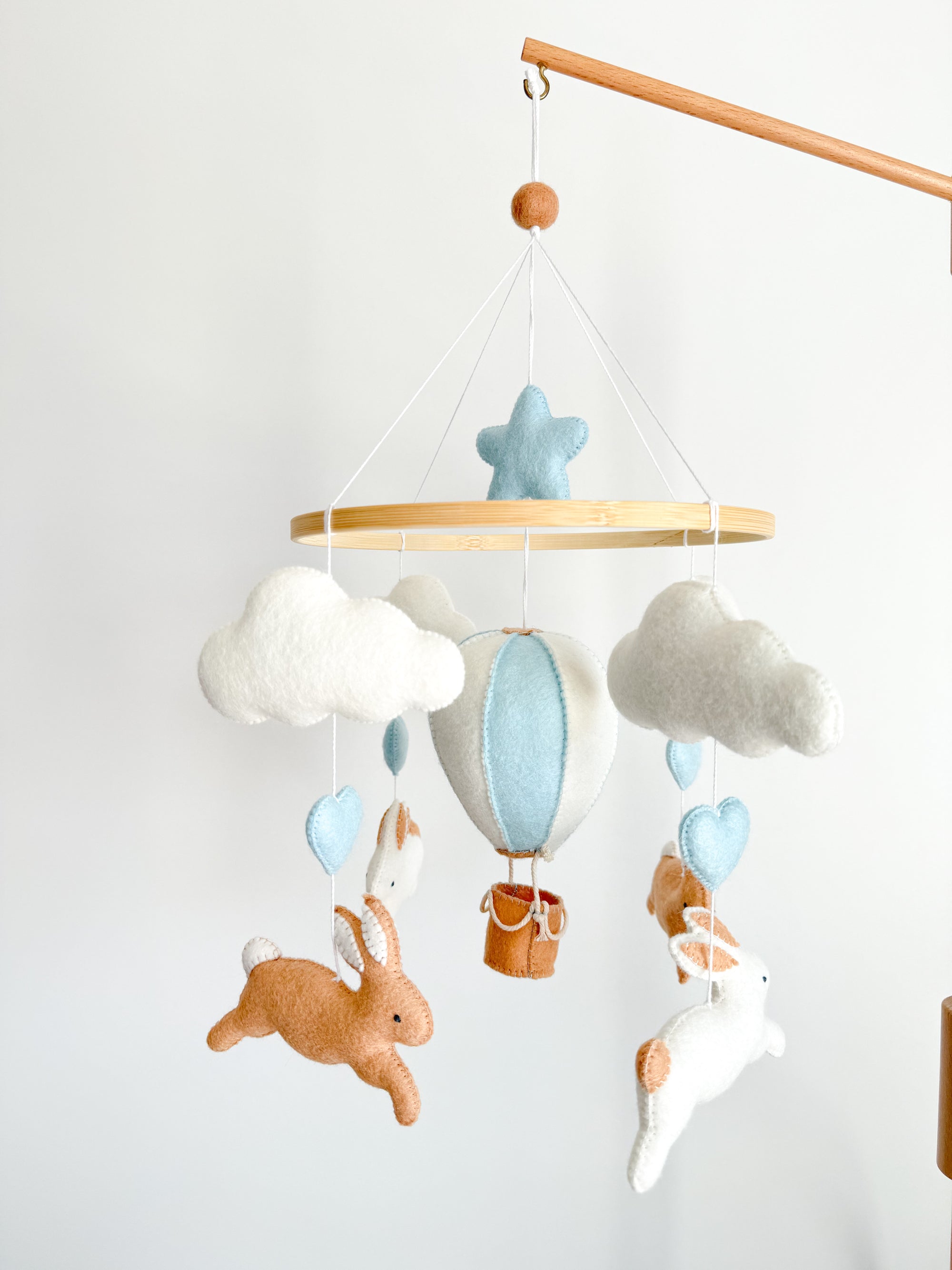 Brown bunny mobile with blue air ballon