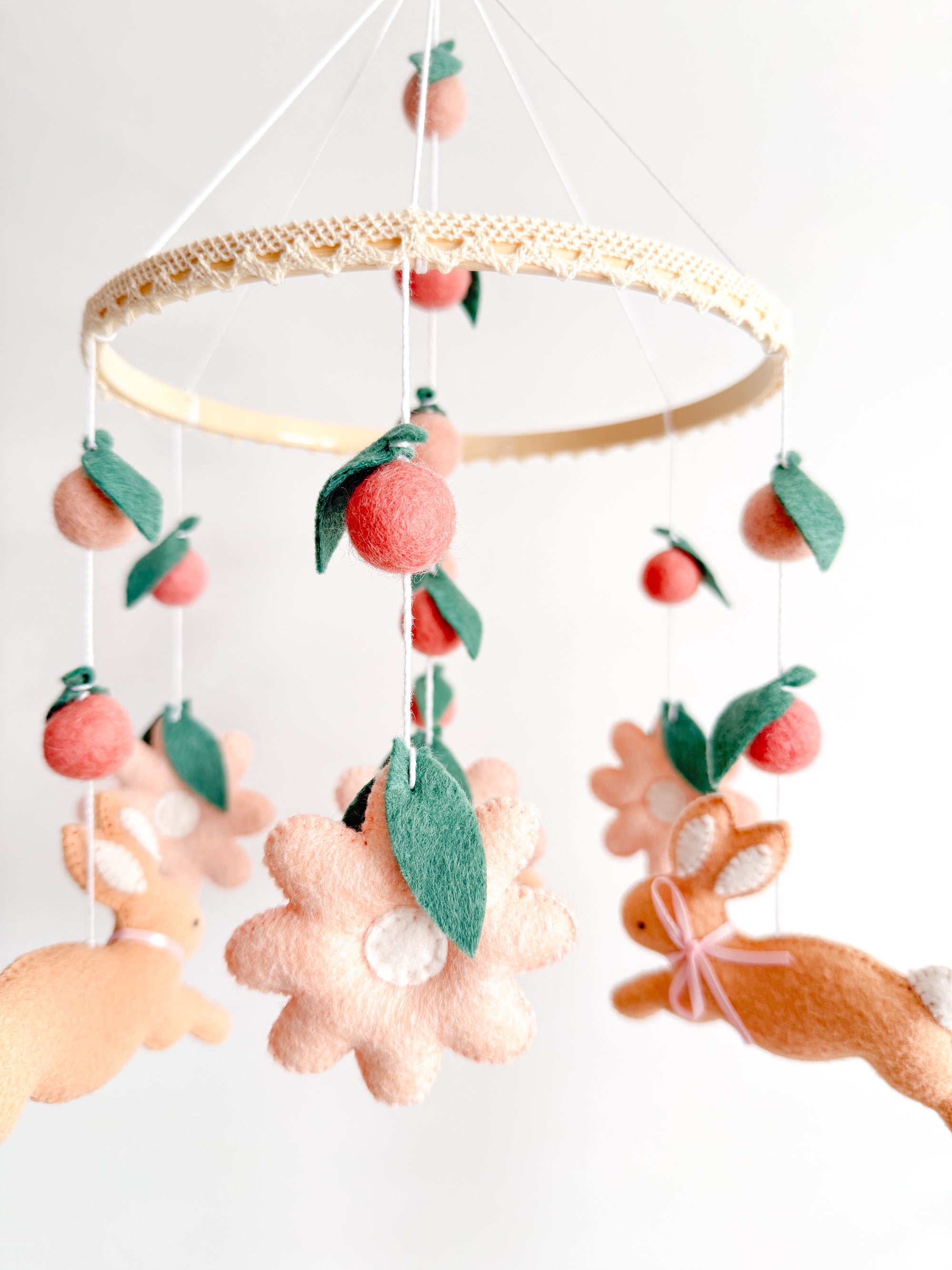 Rabbit mobile with pink flowers