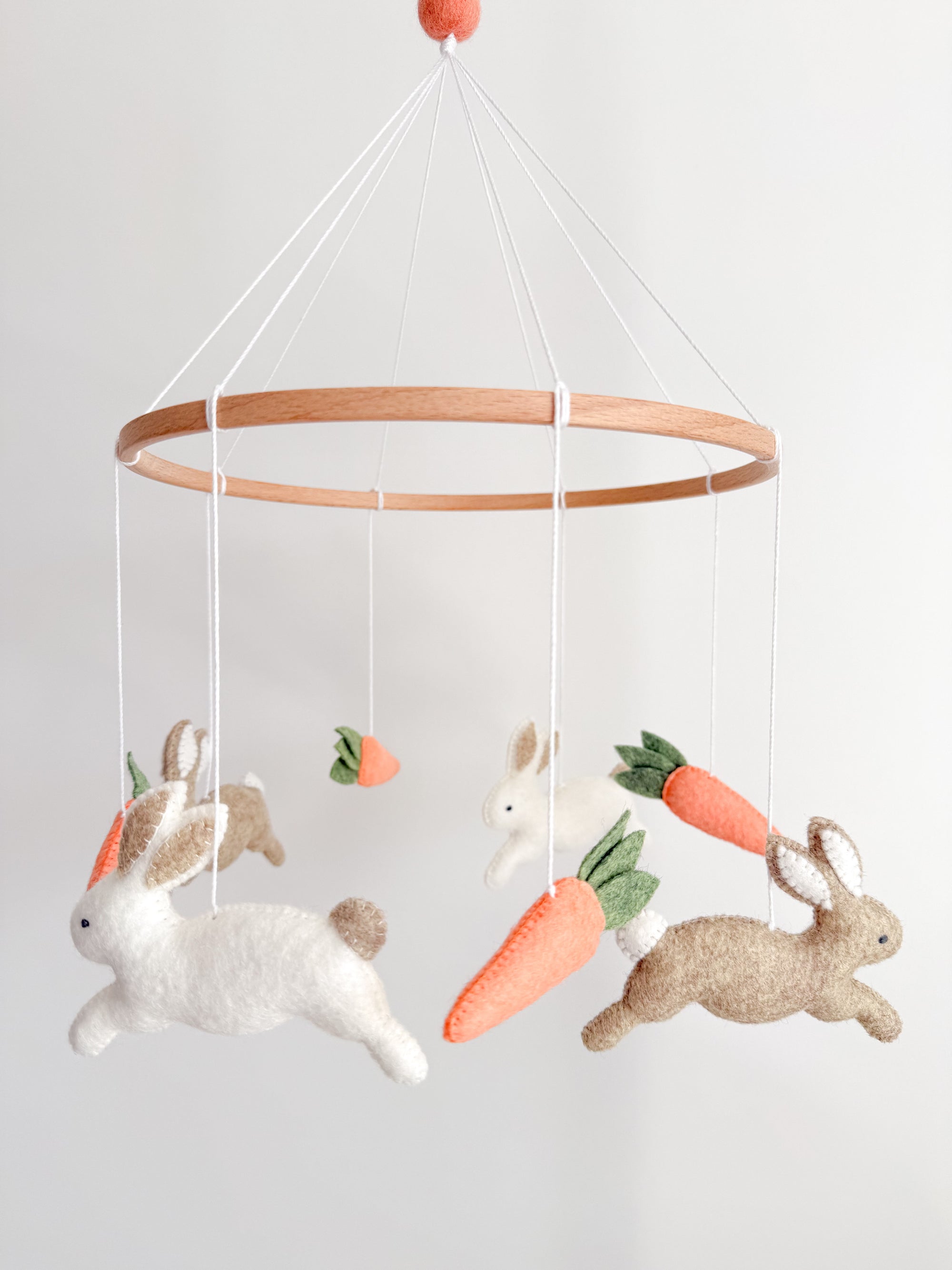 Minimalist bunny mobile with carrots