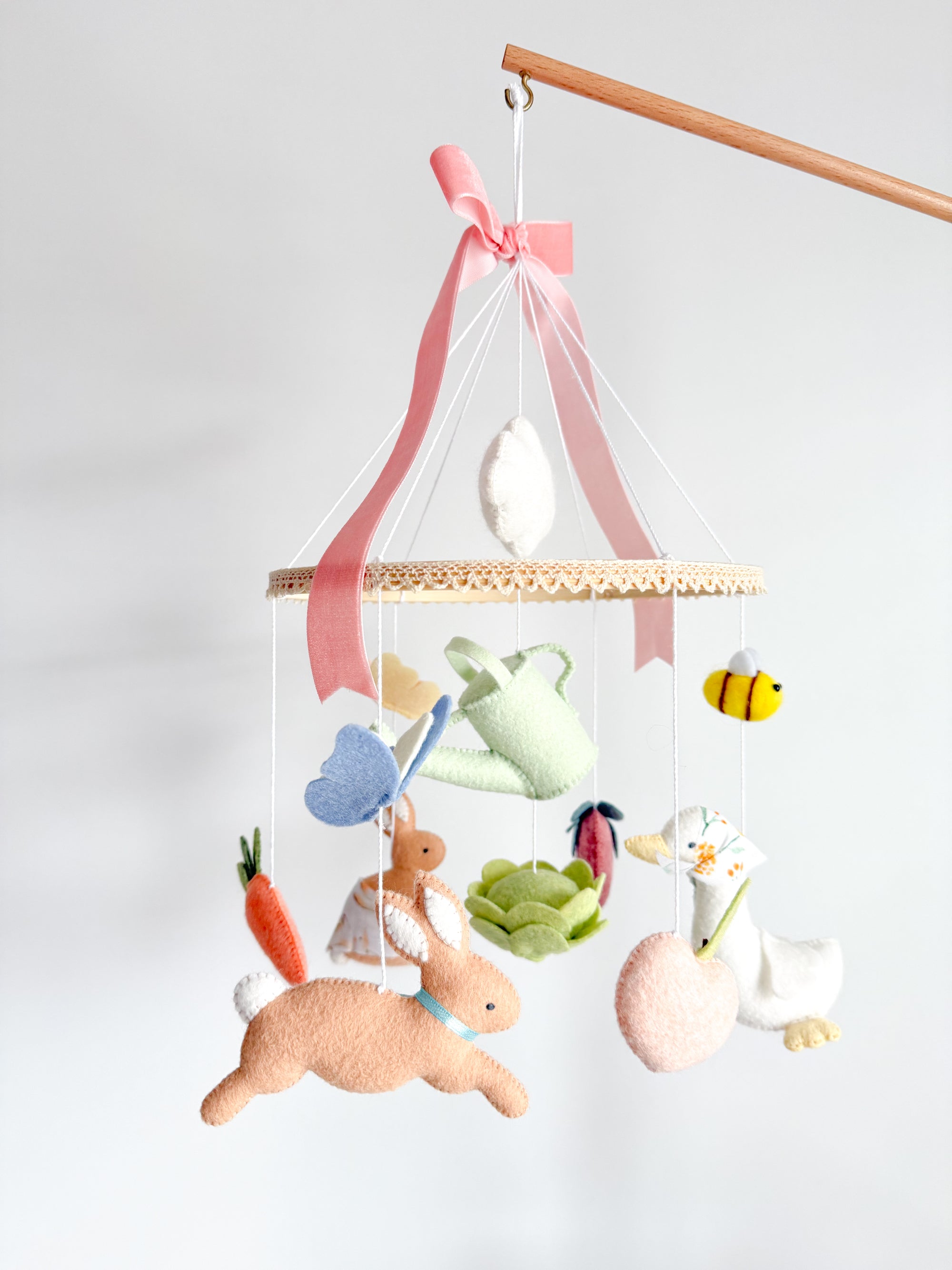 Garden rabbit mobile with pink bow