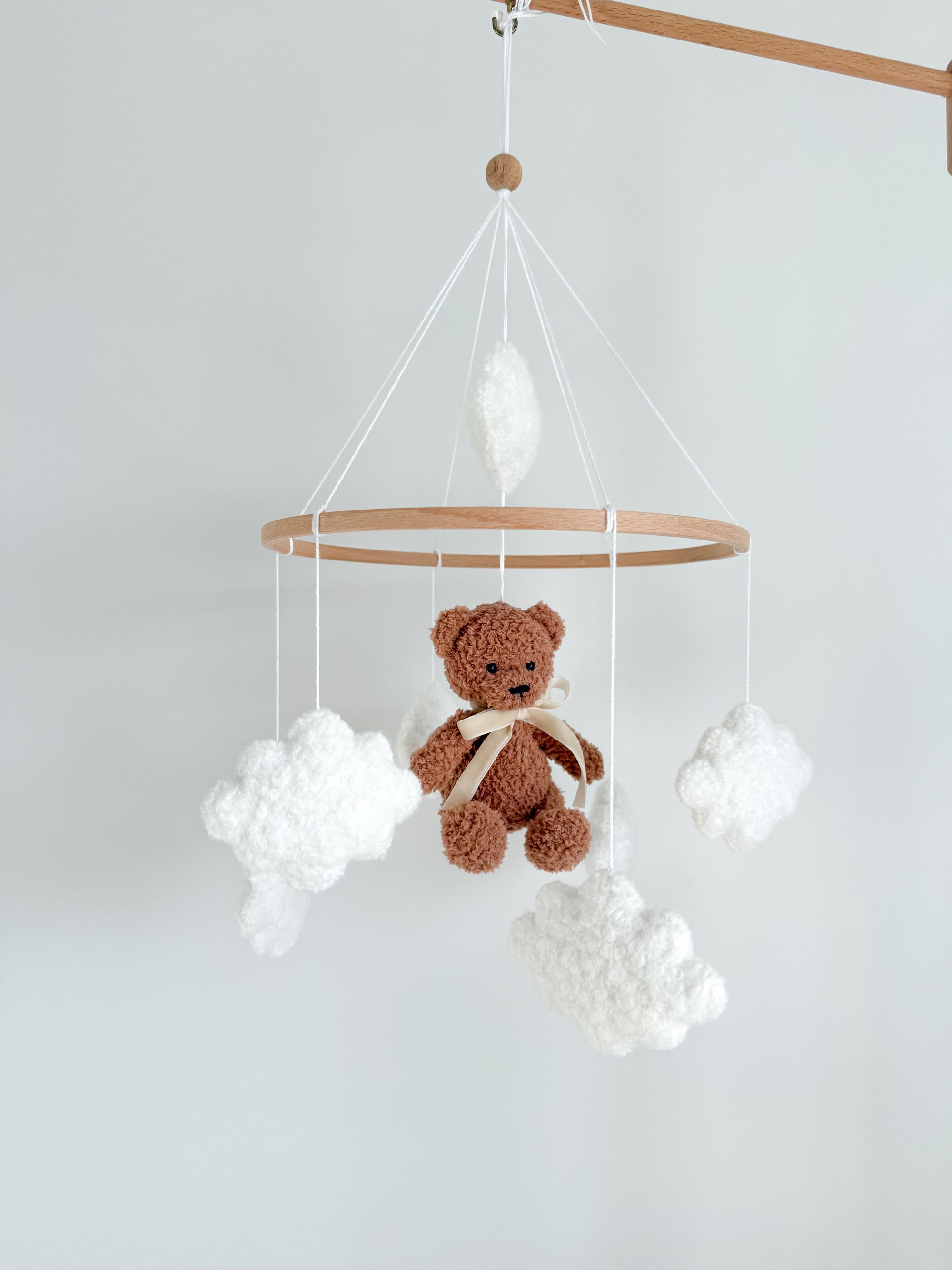 Boucle mobile with brown teddy bear