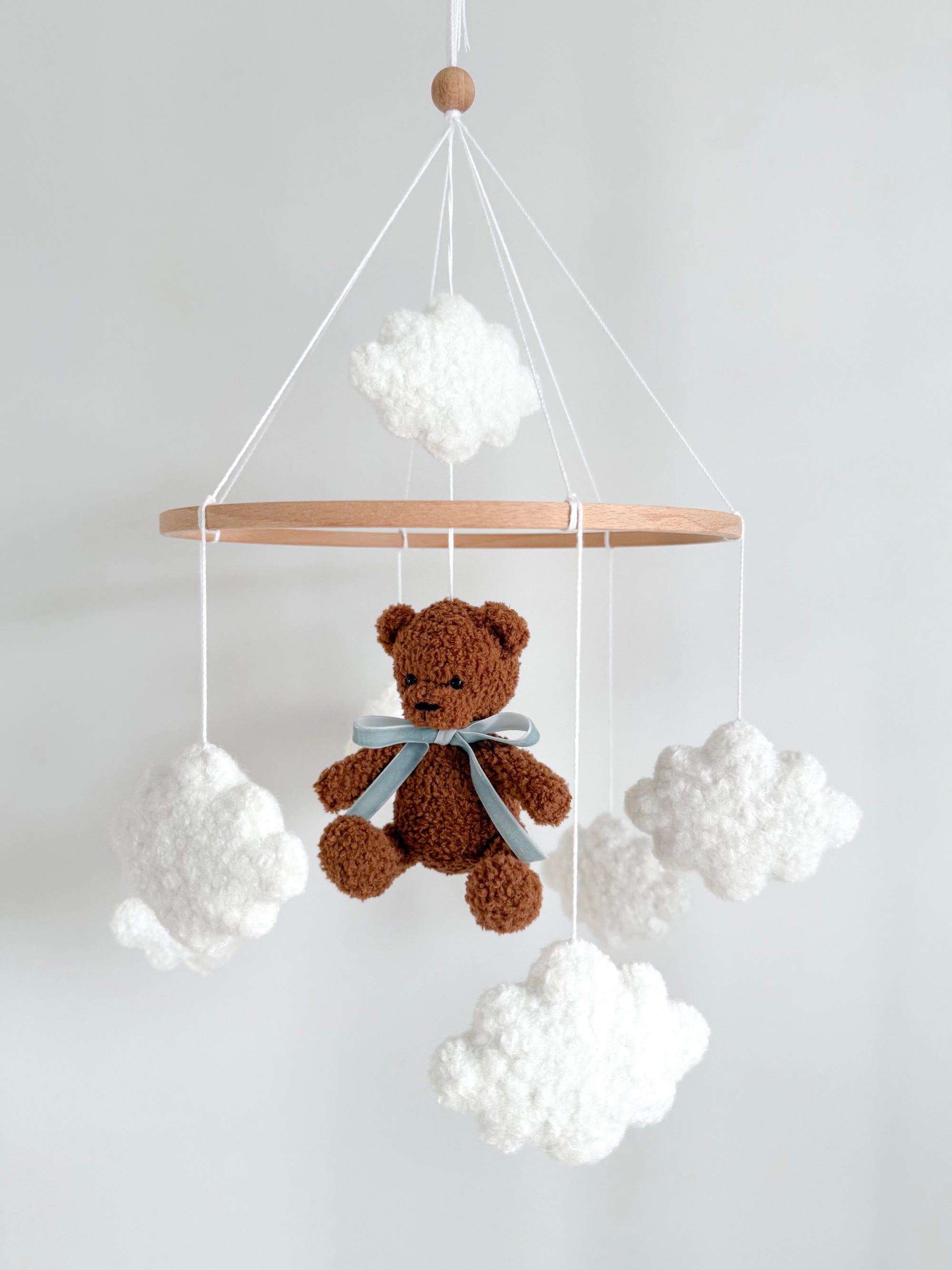 Boucle mobile with dark brown teddy bear