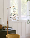 Mobile with a white rocking horse and a blue bow