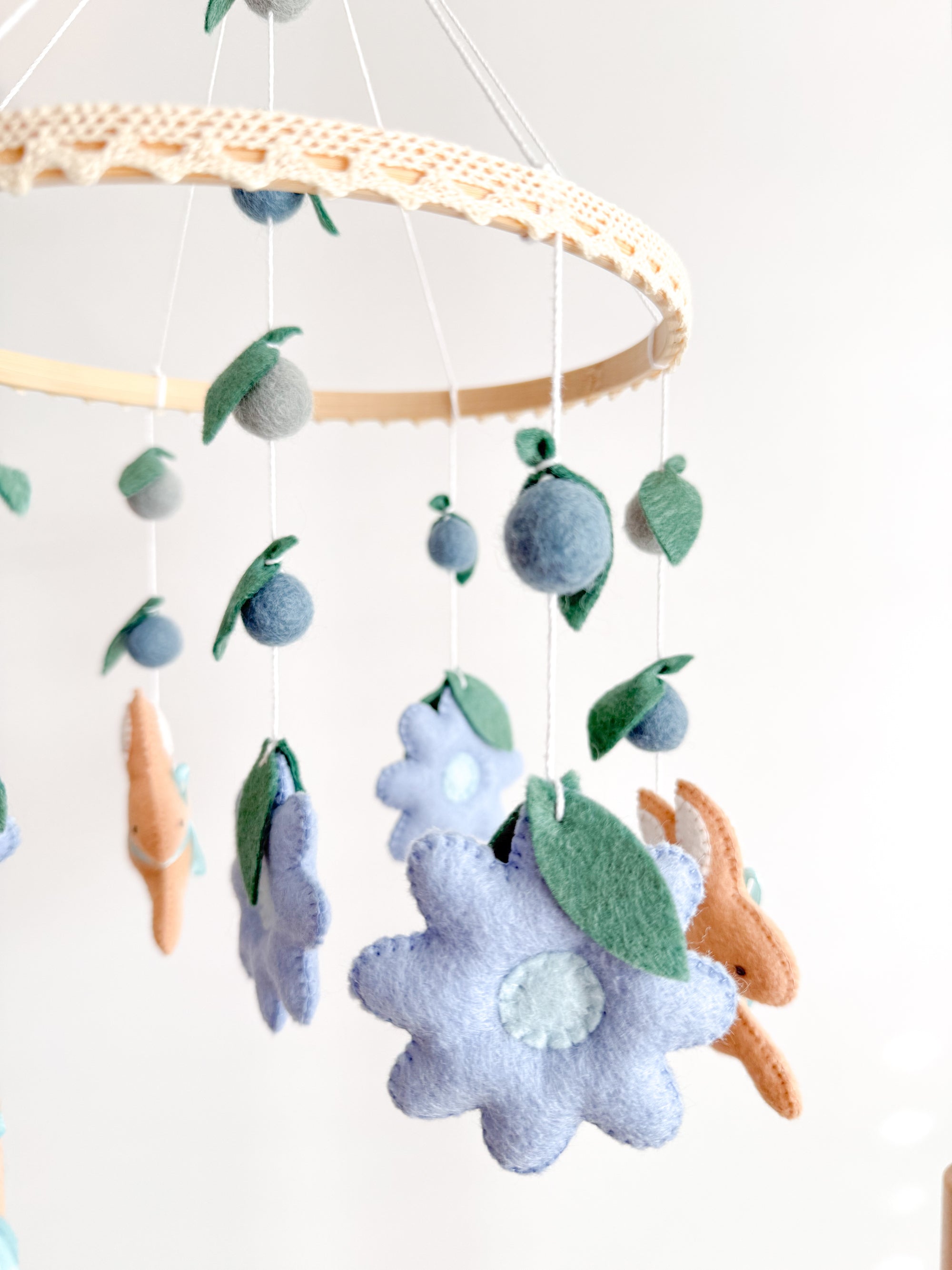 Rabbit mobile with blue flowers