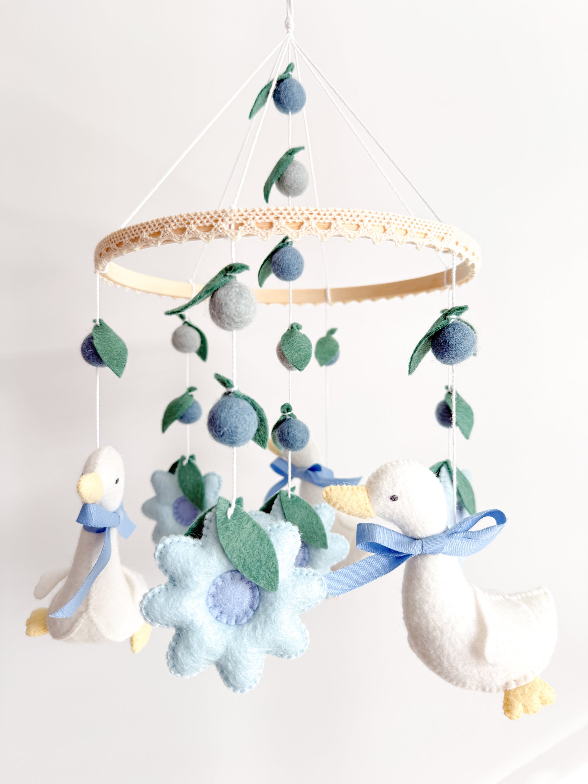 Goose mobile with blue flowers