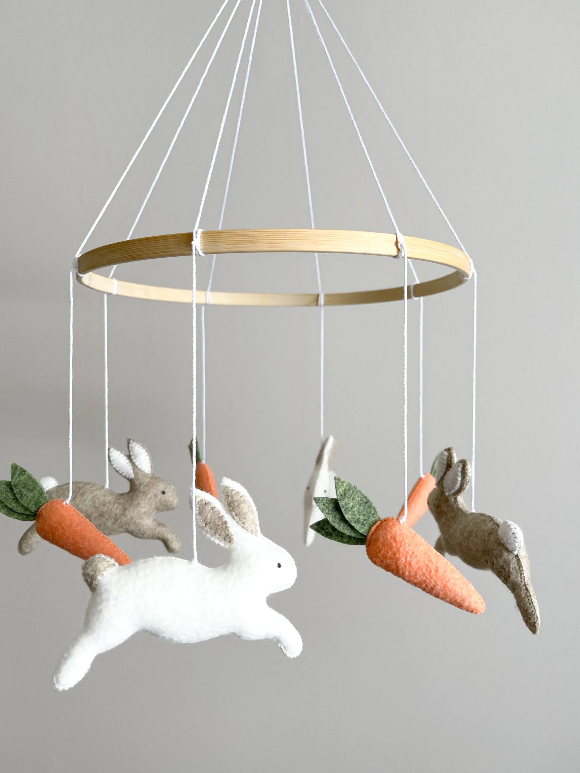 Minimalist bunny mobile with carrots