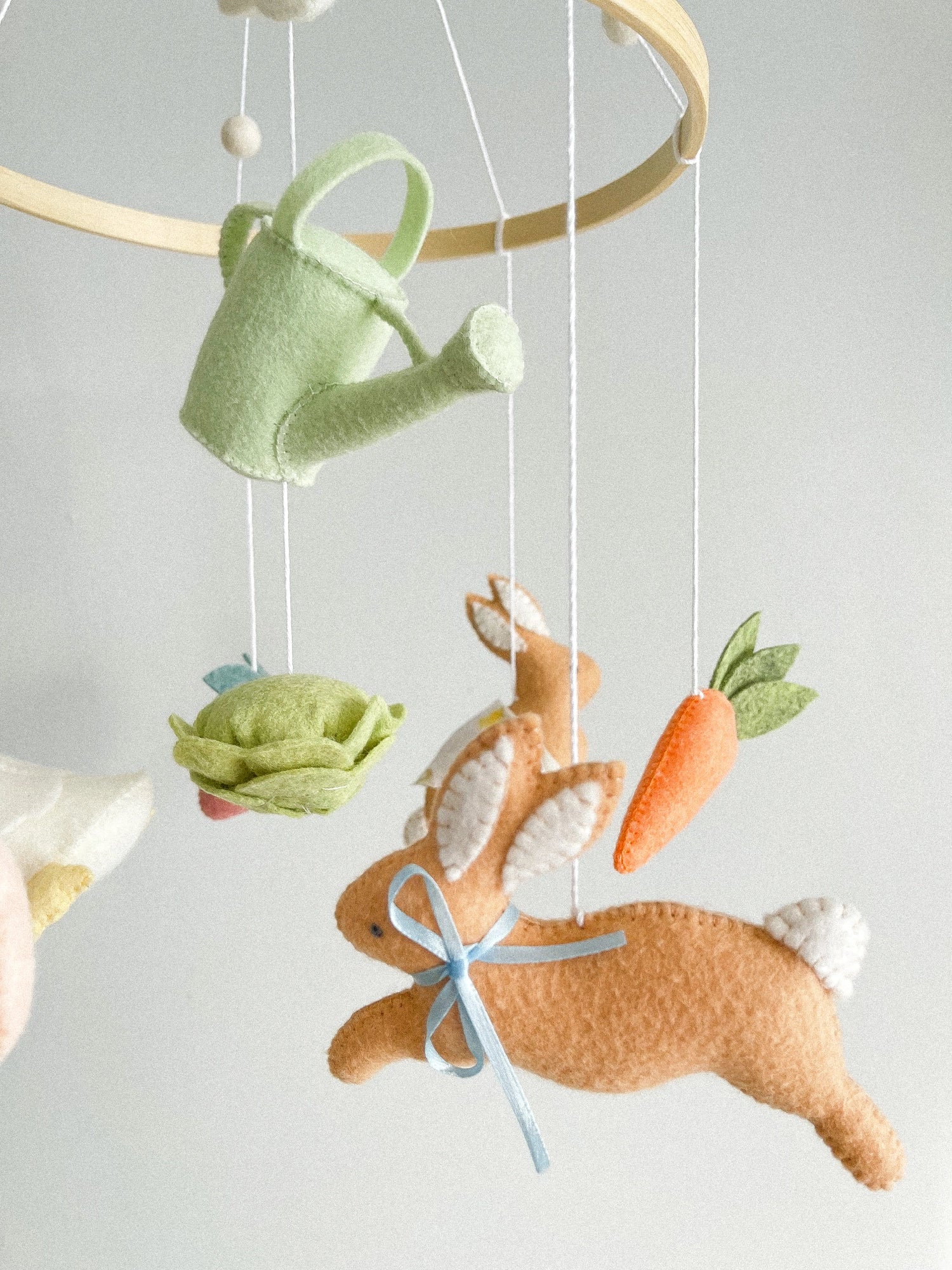 Garden rabbit mobile with watering can
