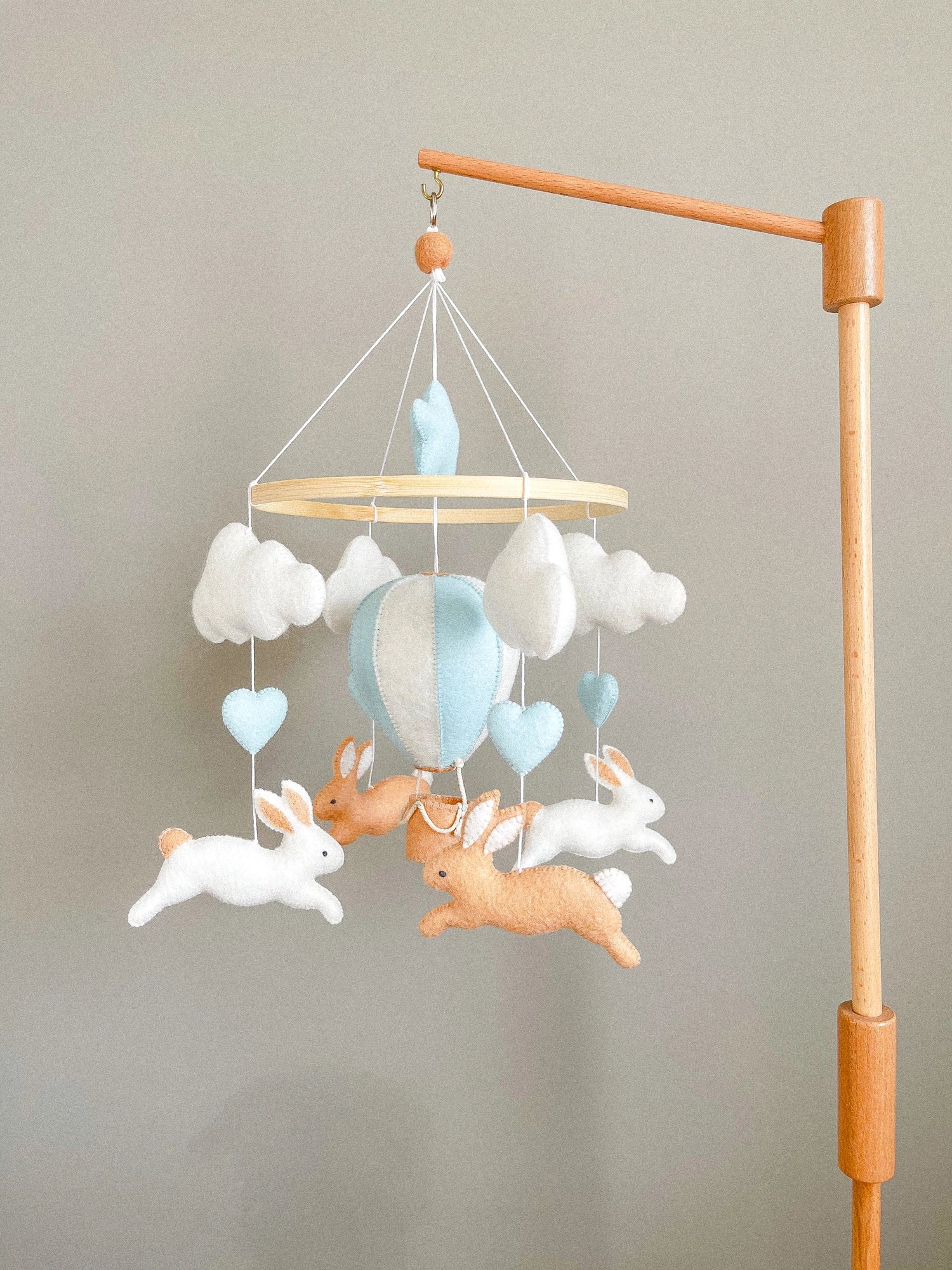 Brown bunny mobile with blue air ballon