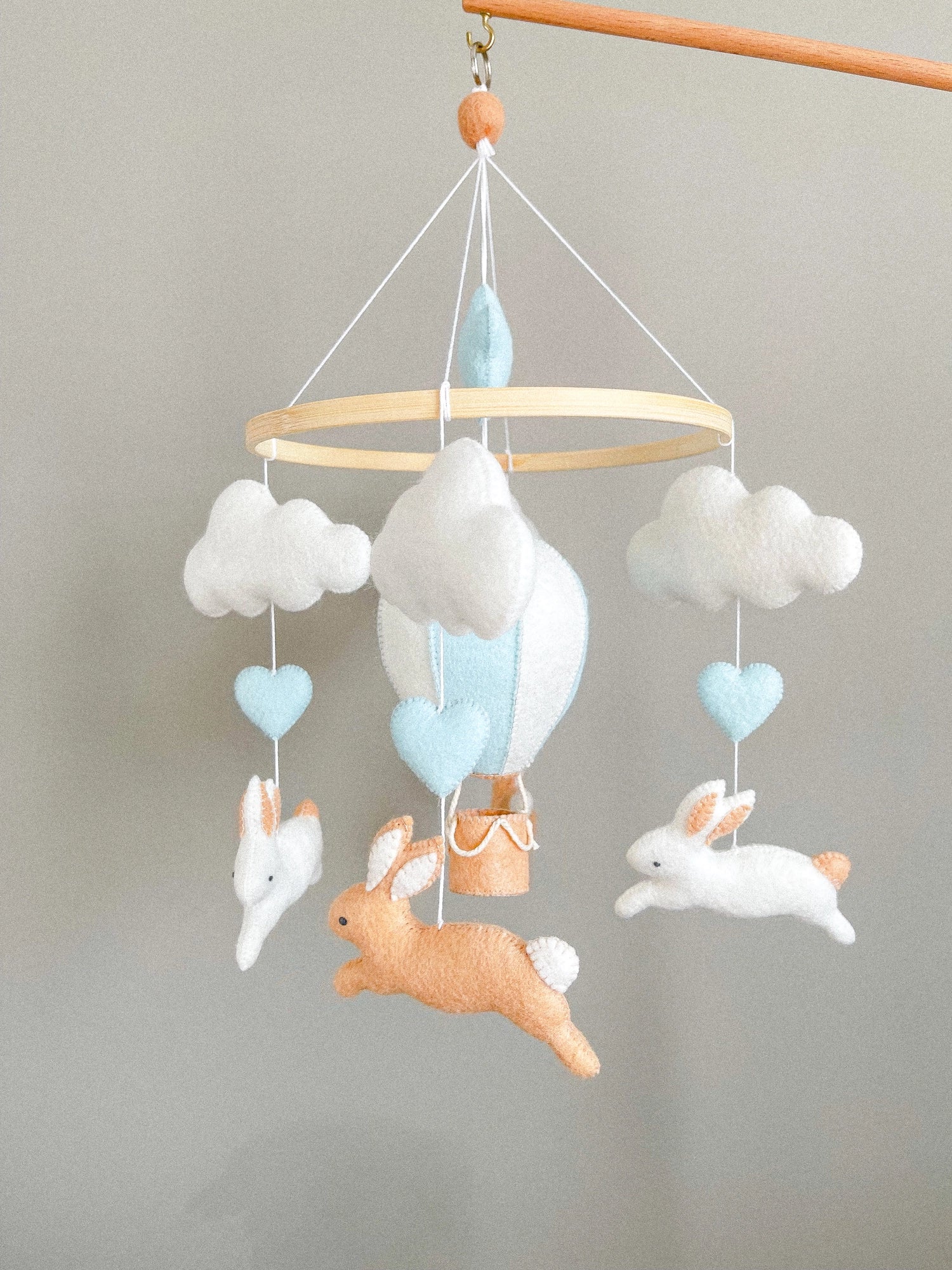 Brown bunny mobile with blue air ballon
