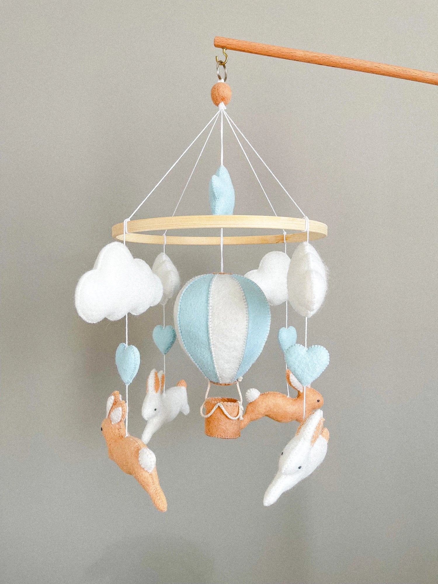 Brown bunny mobile with blue air ballon
