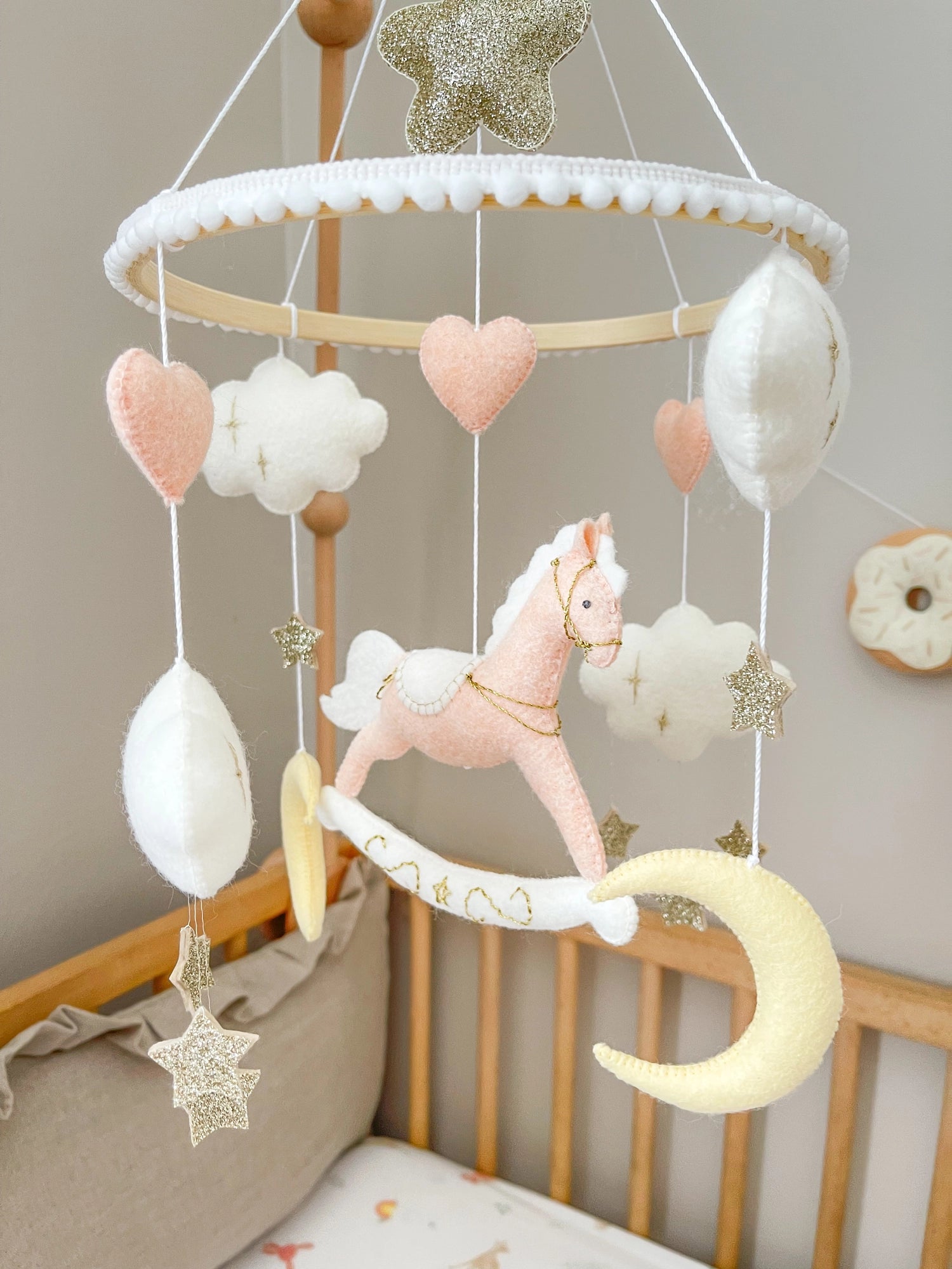 Pink rocking horse mobile with clouds