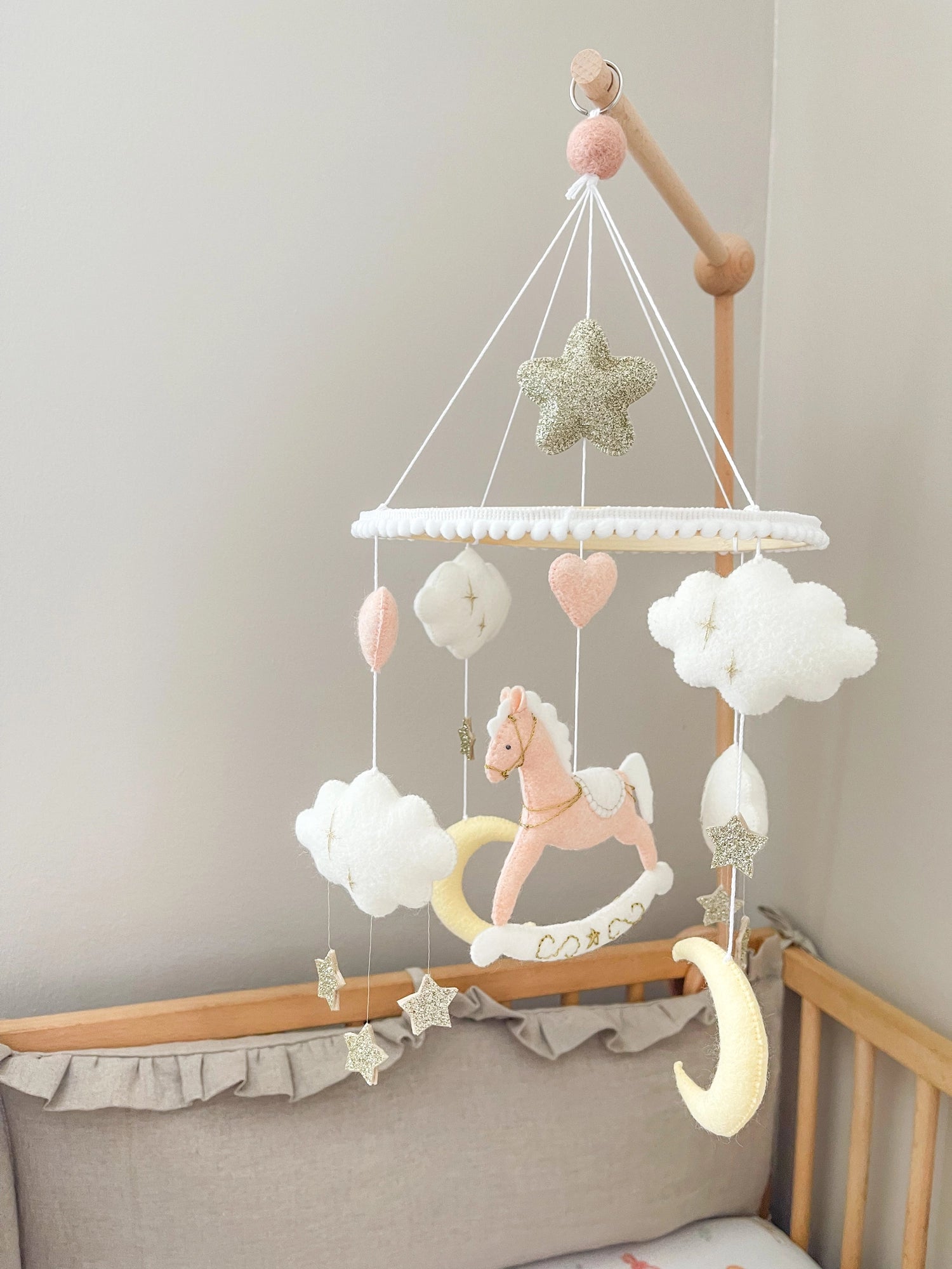 Pink rocking horse mobile with clouds