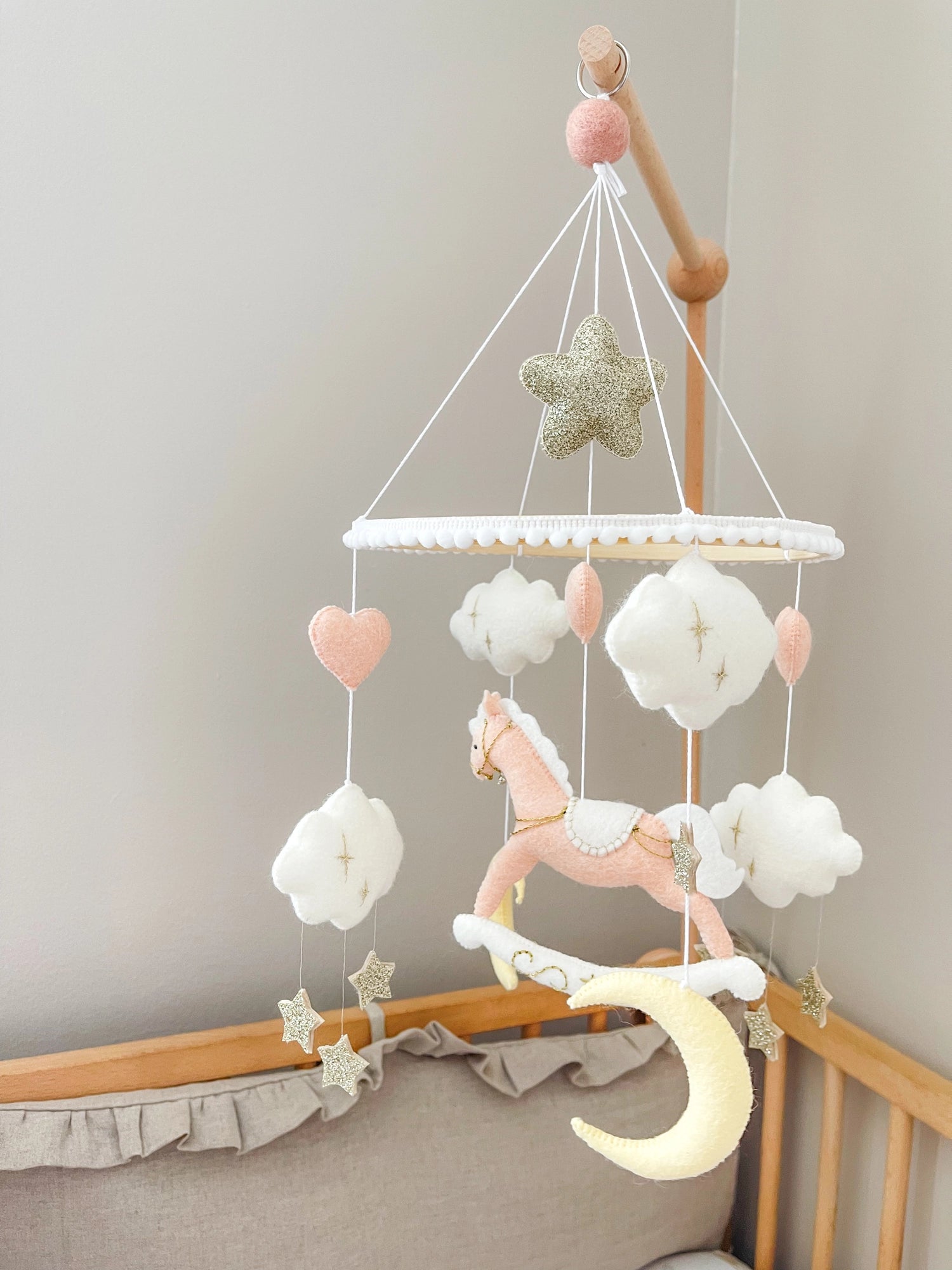 Pink rocking horse mobile with clouds