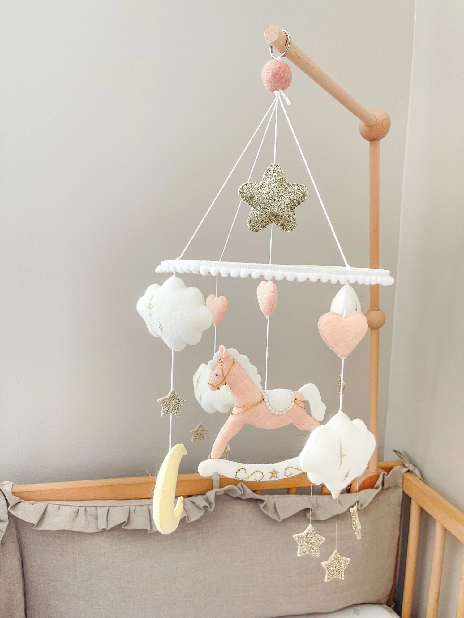 Pink rocking horse mobile with clouds