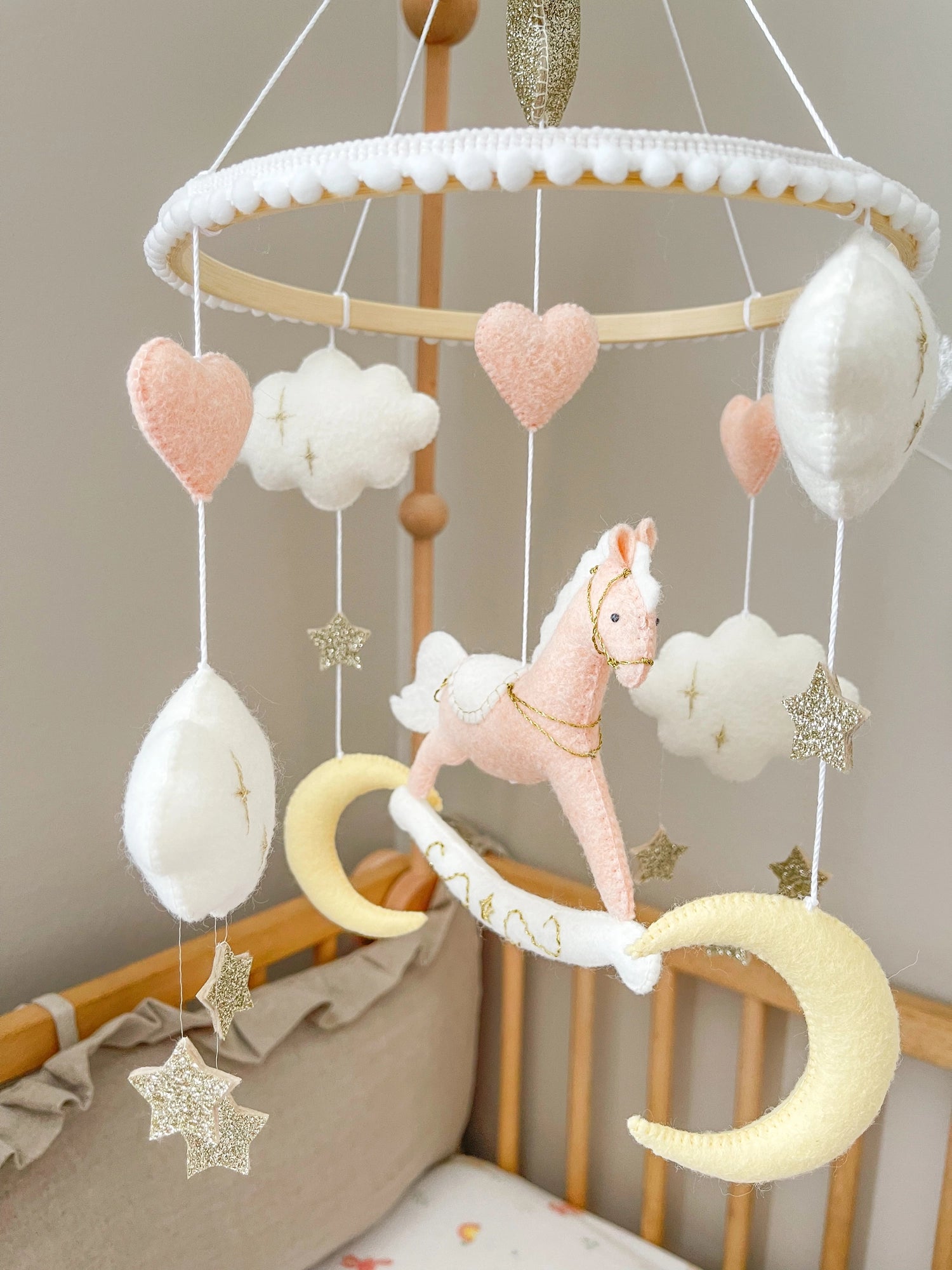 Pink rocking horse mobile with clouds