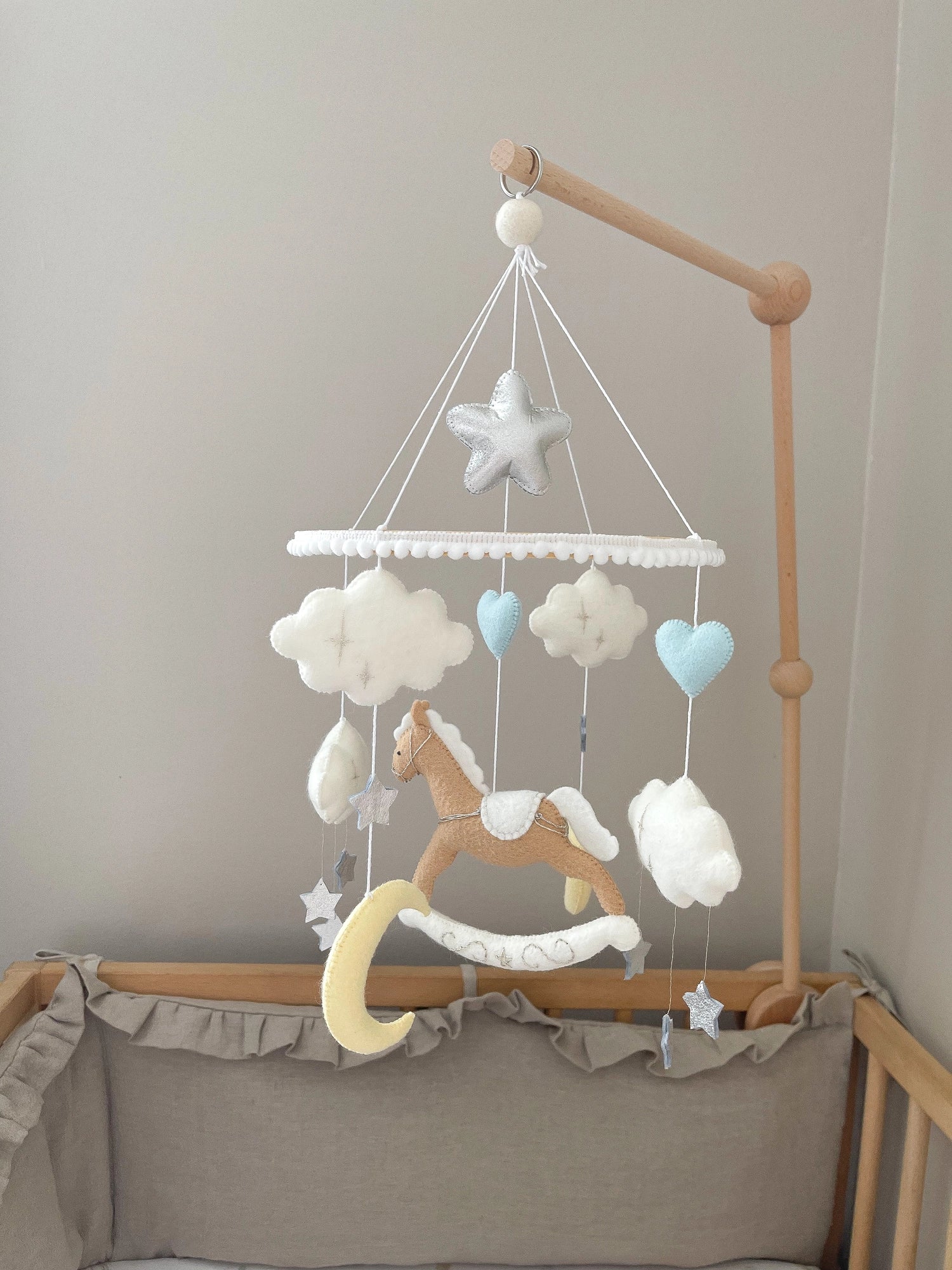 Brown rocking horse mobile with clouds