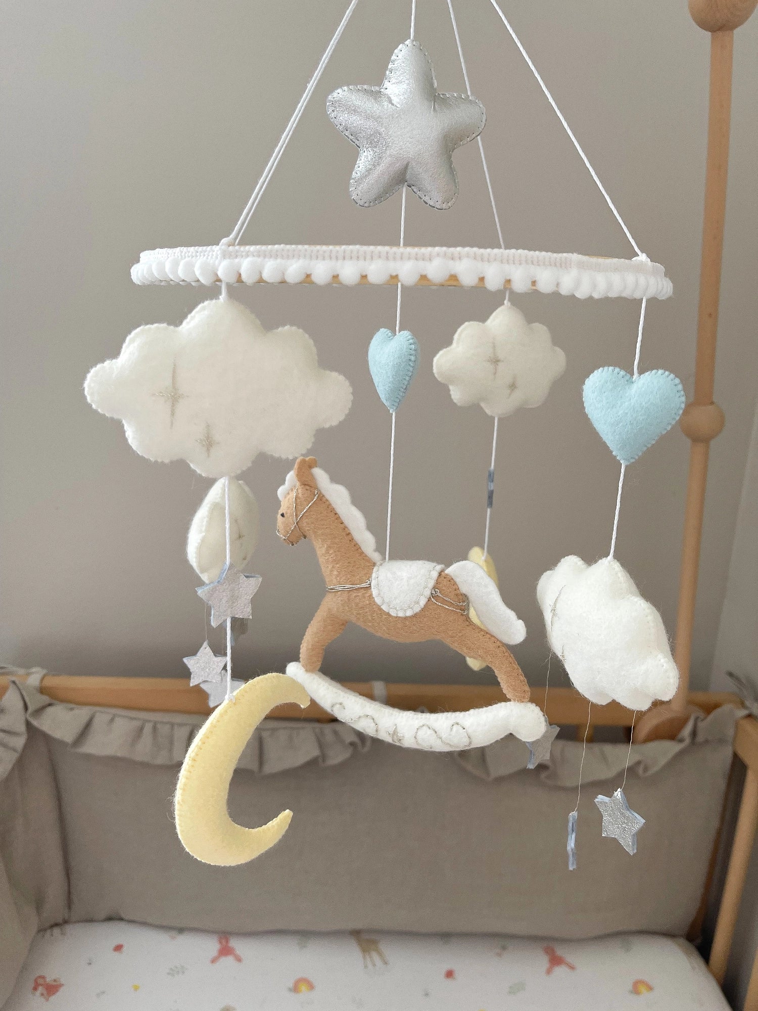 Brown rocking horse mobile with clouds